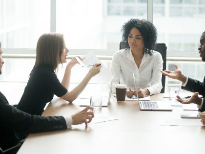 Business partners discussing contract at lawyer's office