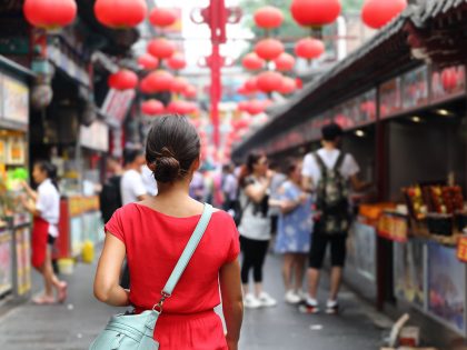 Woman tourist walking in China