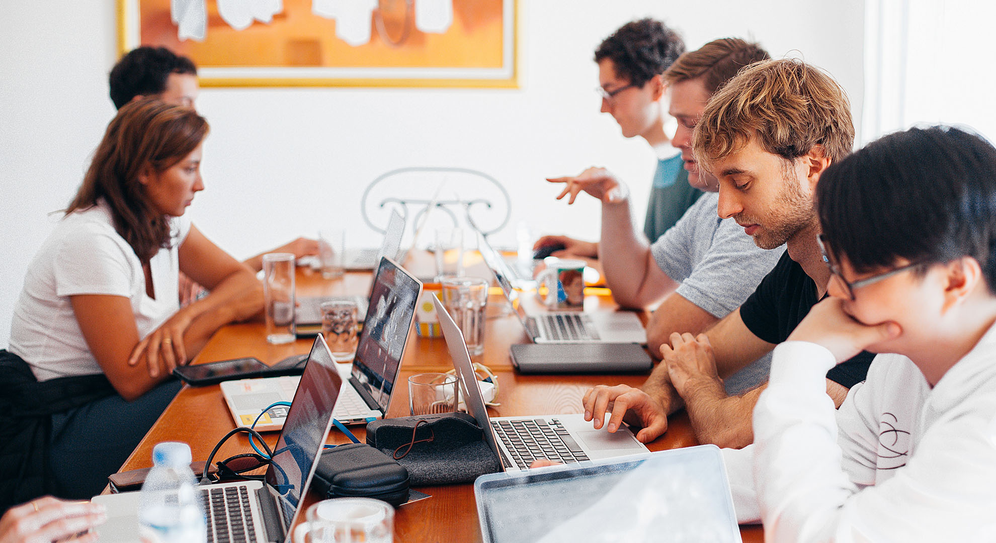 Team sharing desk to work