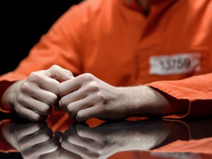 Arrested person hands closeup, prisoner talking to lawyer